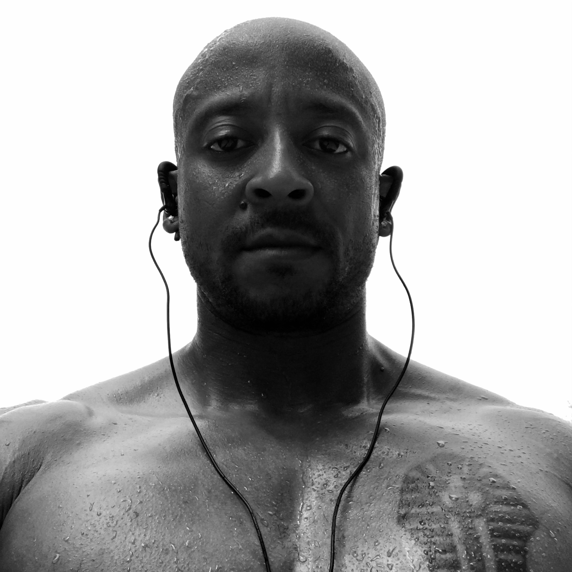 Post workout headshot selfie of Allen Hamlette with headphones in a black and white photo.