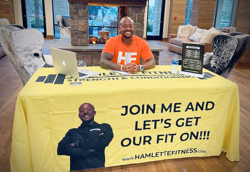 Allen at the HAMLETTE FITNESS meeting table